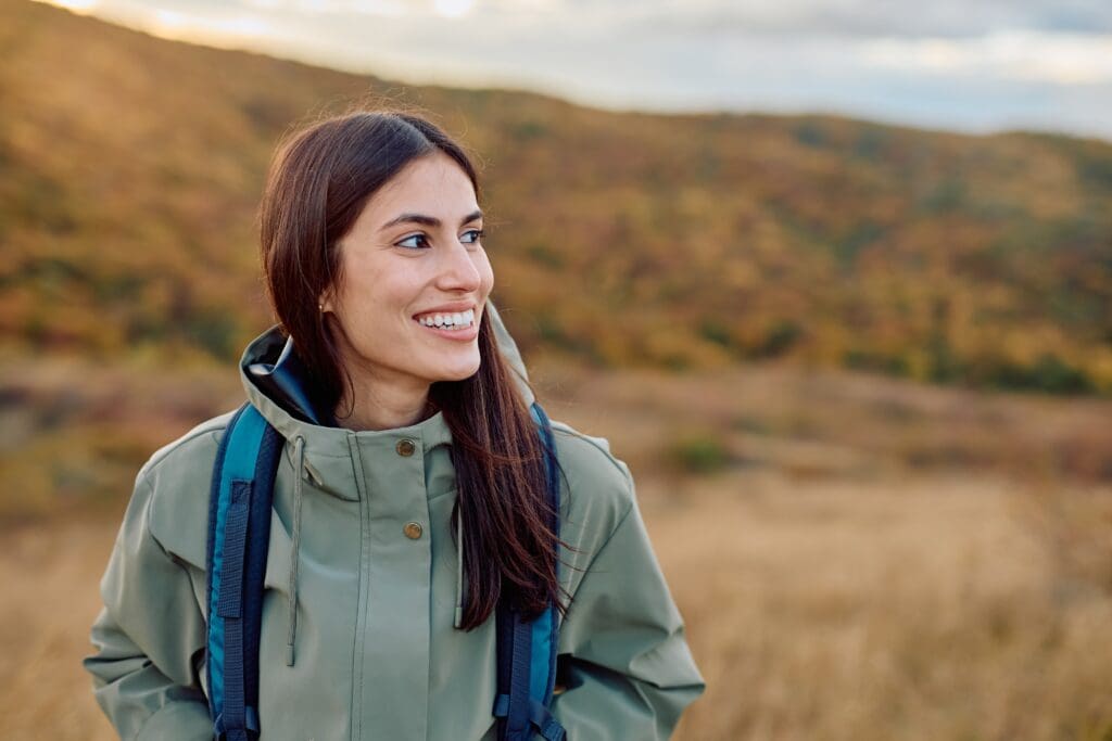 healthy young woman smiling outdoors